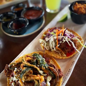 Taco Guild signature dishes CarnitasChicken TingaGreen Chile Queso